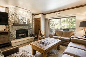 Living room with wood fireplace in 229