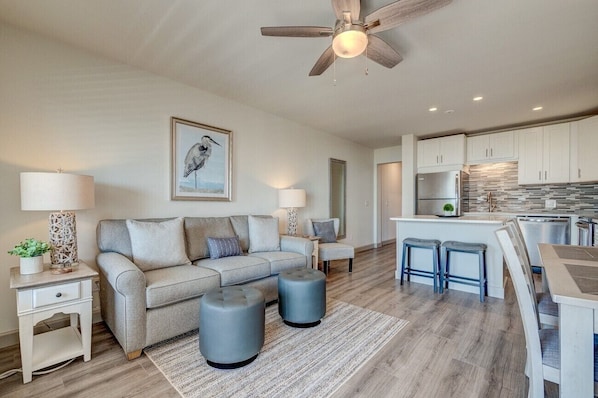 Ocean Dunes 317 - Living Area - Gorgeous, renovated living area with wood-like tile flooring.