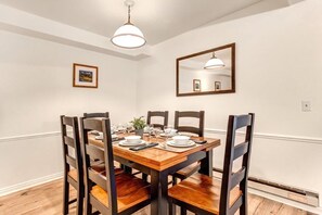 The dining area has a dining table and seating for 6 guests.