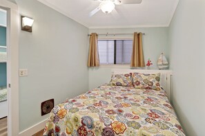 Bedroom - Bedroom has queen sized bed with ceiling fan and 4 drawer dresser.