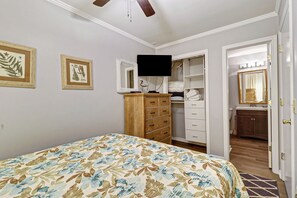 Bedroom - Ceiling fan and lots of storage in this queen sized bedroom with new paint and bedding. .