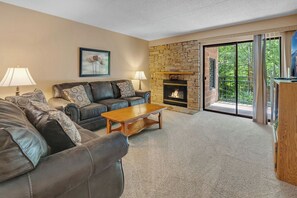 Cozy living area with gas fire for chilly seasons.