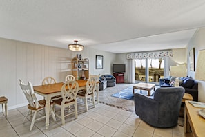 Dining/living area - Bright and large dining room table can seat up to 8 people.