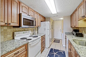 Kitchen - Fully equipped modern kitchen with granite countertops and all major appliances .  Regular drip coffeemaker and toaster oven.