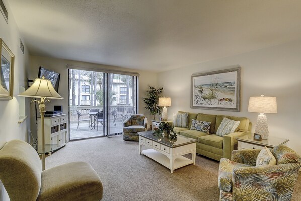 Living Room - The living room and dining area has upscale furnishings and plenty of room for family gatherings.