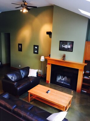 An elevated perspective of the living room and fireplace.