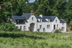 The Cottage is a self-contained wing of Arngomery Court (at the rear)