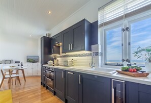 Ground floor: Open plan kitchen, dining and sitting room