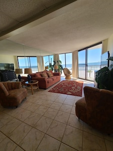 Living room with queen sofa sleeper and ocean view