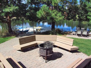 seating around fire pit plus 2 tables and chairs ( in summer)