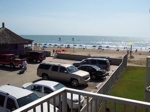 Beachfront view from balcony; Wanna-Wanna beach bar next door!