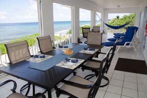 Dining on the covered porch, seating for 8, cafe table for 2, amazing sea views!