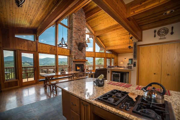 Open Kitchen and Dining, breakfast bar, full range gas stove. Live edge table.