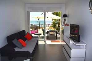 Modern living room equipped with T.V and comfortable furniture