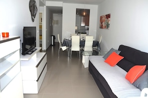 Spacious living room with comfortable sofa and furniture