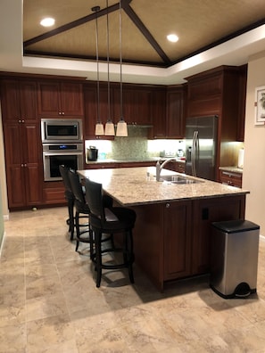 Kitchen: granite counters, mahogany cabinets, stainless appliances, large island