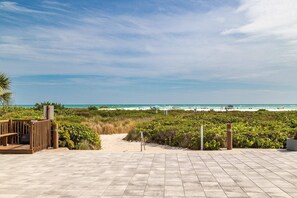Walk out of the beachfront building to your private beach....to warm Gulf waters and gentle waves