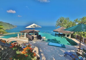 The coral stone pool deck has plenty of loungers, parasols and sun mats