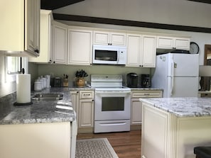 Updated Kitchen with Granite and Oak Floor.