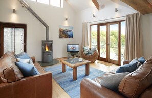 Ground floor: Double height sitting room with wood burning stove