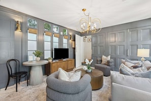 Inviting living area featuring  a stylish bistro table ideal for light meals or work.