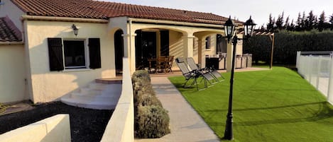 The front of the villa, showing the step entrance and the new ramp access.