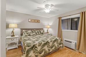 Main bedroom - King sized bedroom in main bedroom along plenty of light, ceiling fan and individual A/C unit.