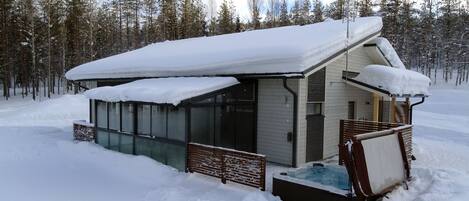 House from the backyard, hot tub, glass terrace