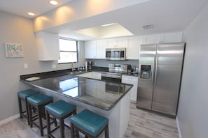 Newly Renovated Kitchen with Granite Countertops, New Stainless Steel Appliances, and Breakfast Area for 4