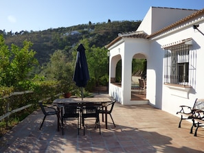 The front of the villa with covered terrace.