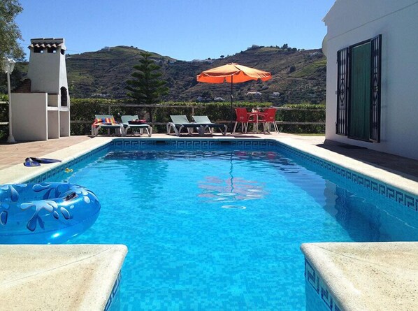 Swimming pool with countryside views.