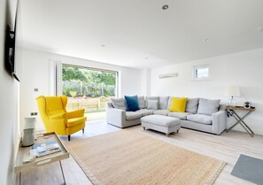 The impressive, bright and spacious open plan living area