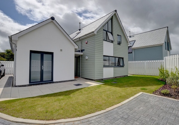 The Beach House is a newly built, high quality beach villa on a small exclusive development