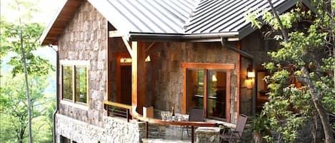 Side View of Cabin-front porch and outdoor fireplace facing west/sunsets