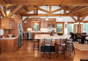 Fully stocked kitchen with dining area