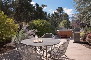 Outdoor dining area and hot tub