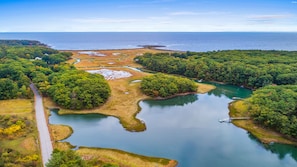 an overview of Chauncey creek, the house and pier on the left
