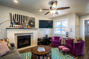 Gather in the colorful living area to watch your favorite show.