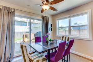 The living room area has sliding glass doors to lead out to the back deck and hot tub.