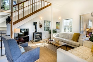 Open and airy living room with plenty of seating.