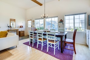 The large dining table is a great gathering spot for meals and games.