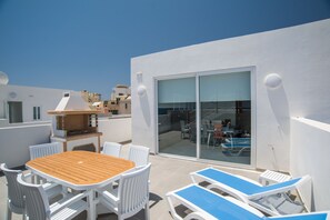 Outdoor Area; Table, Chairs, Sun Loungers and barbecue 