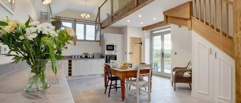 Impressive kitchen and dining area with huge amounts of space and light