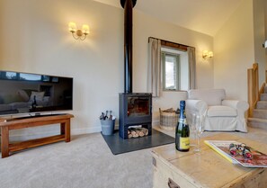 Enjoy a bottle of fizz whilst curled up on the sofa in front of the woodburner
