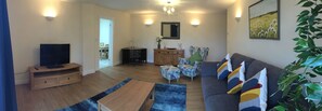 Living room with flat screen TV,DVD and working desk