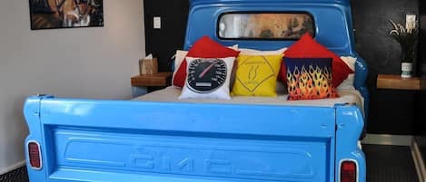 Yes, it is a real and literal, 1963 GMC pick-up truck bed!