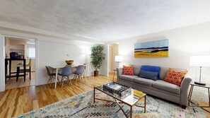 Stylish living space with a cozy sofa and dining area.
