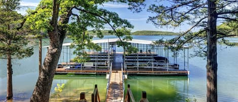 Boat dock with Covered slips, swim deck...just steps from the cabin!