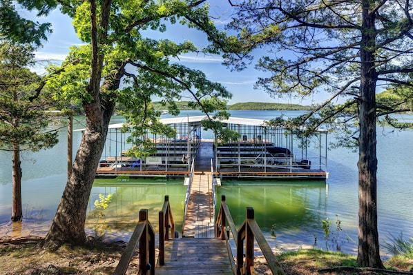 Boat dock with Covered slips, swim deck...just steps from the cabin!