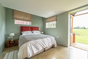 The Dairy, Lodge Farm, Freston: Ground floor bedroom with french doors leading to the garden